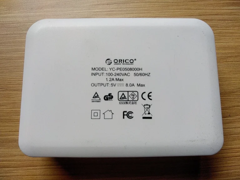 Reference photograph: Orico YC-PE0508000H multiport USB charger-1.jpg. Not verification of the exact planned product.